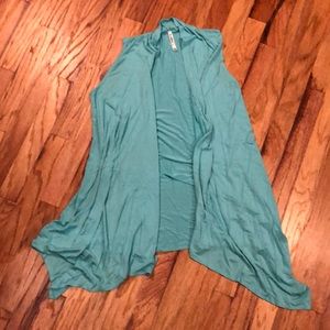 Teal blue soft sleeveless open shirt/vest.